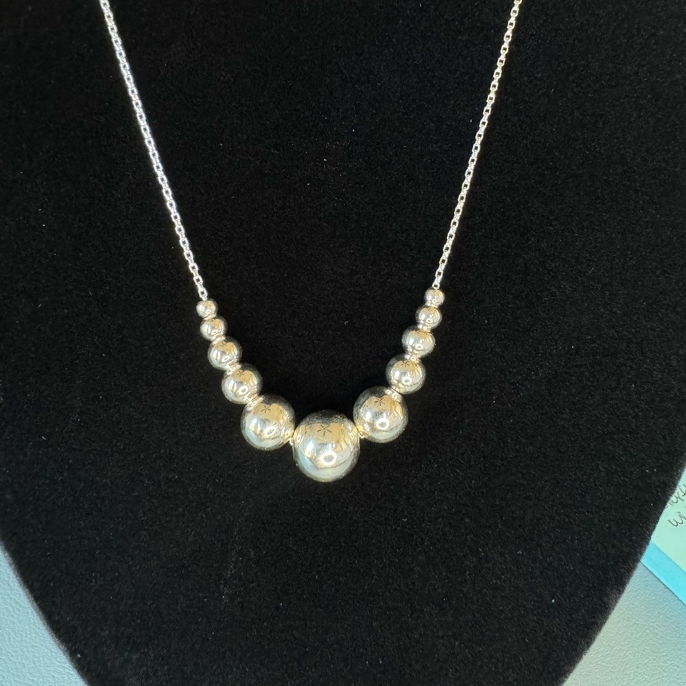 Elegant Sterling Silver Necklace with multiple size beads